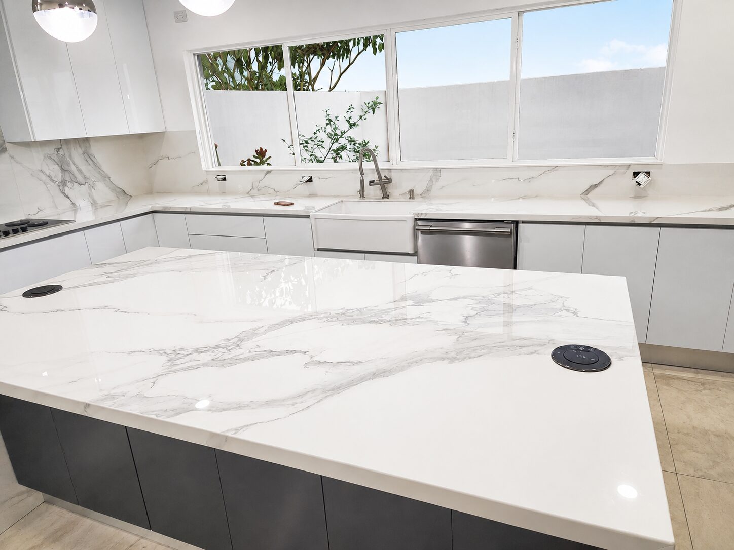 White granite kitchen countertop with natural gray veining in Guanacaste