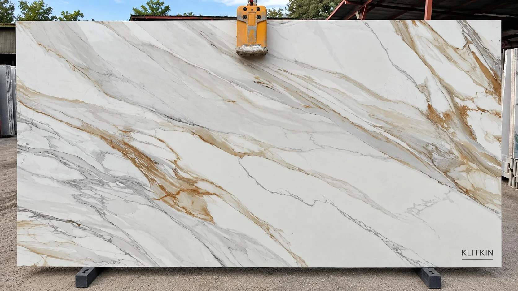 Klitkin white porcelain surface with long flowing gray and gold veins